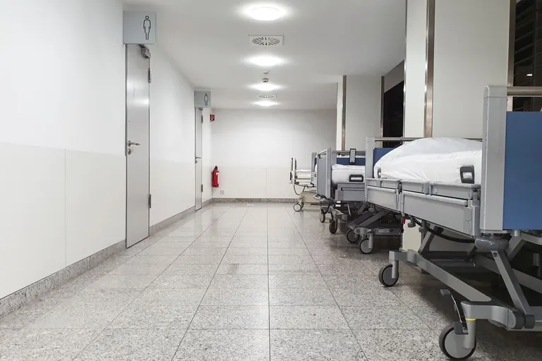 Hospital beds in a bright healthcare corridor