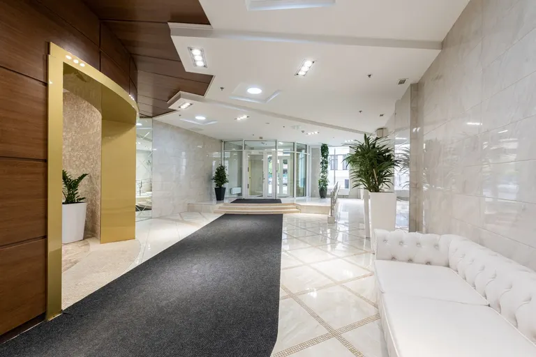 Modern hotel lobby with seating and reception areas