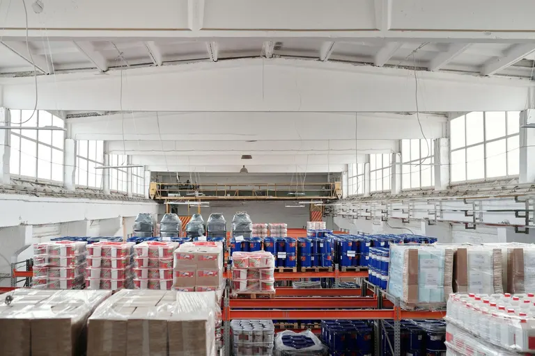 Warehouse aisles with organized shelving and pallets