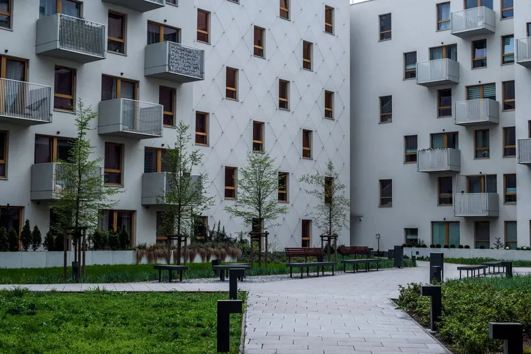 Apartment buildings surrounding a landscaped courtyard