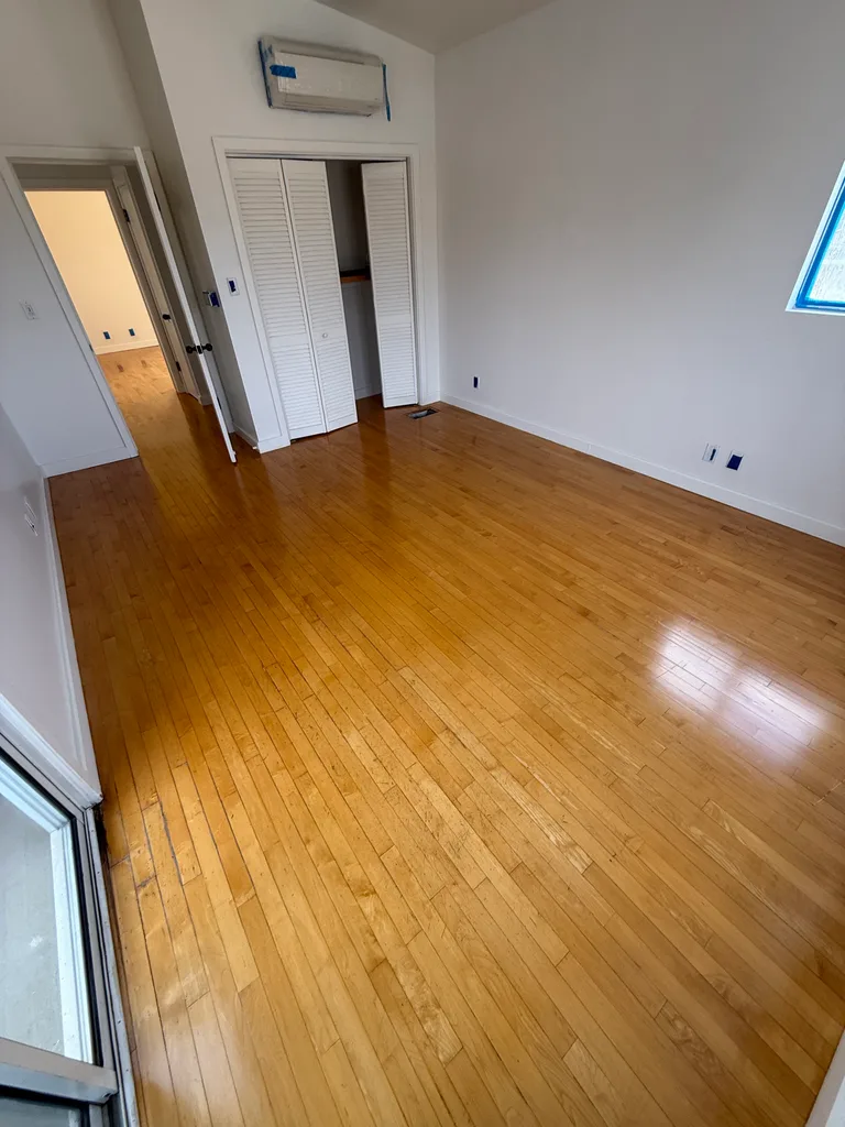 Finished hardwood bedroom floor and closet