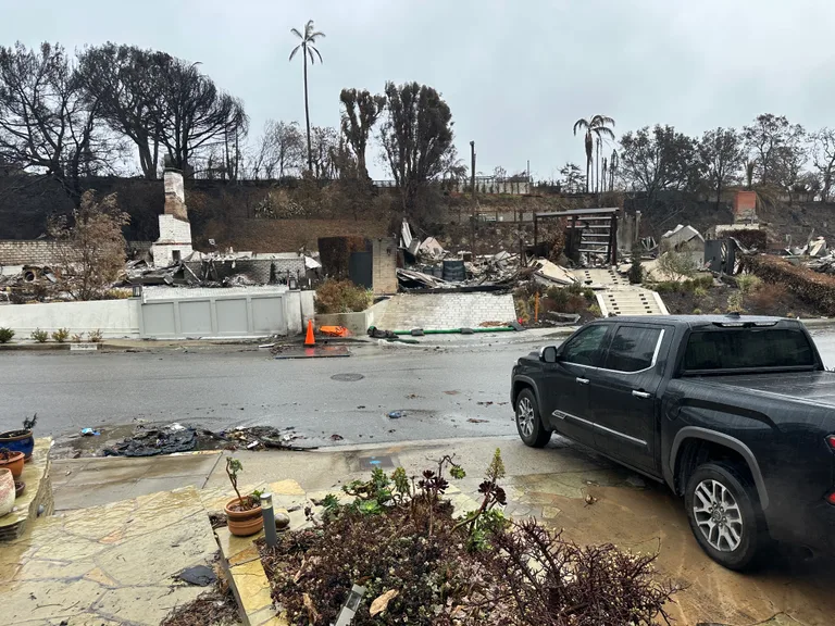 Fire damaged property and street debris