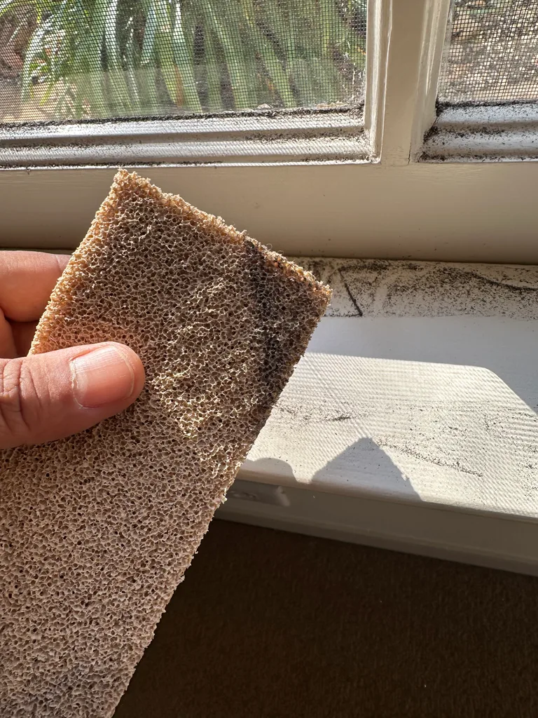Soot cleaning sponge at window sill
